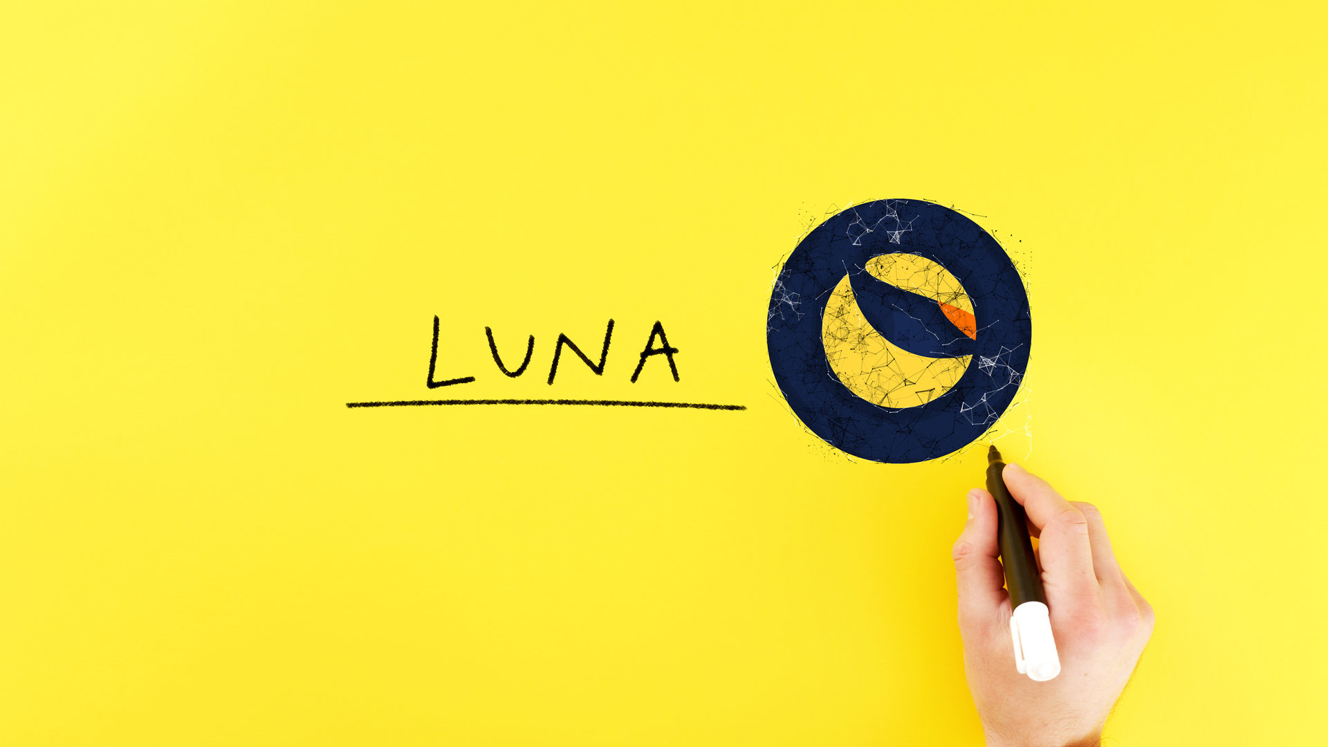man draws a terra icon next to the inscription luna. blockchain and cryptocurrency concept