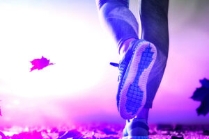 athlete's foots close-up on autumn walk in nature outdoors. healthy lifestyle and sport concepts.