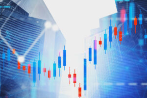 Financial graphs and network hologram over modern city background with skyscrapers. Concept of trading and stock market. Toned image double exposure