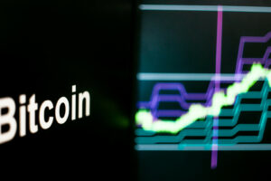 Bitcoin Cryptocurrency token. Rise in price and Growth of quotations, the green graph up. The behavior of the cryptocurrency exchanges, concept. Modern financial technologies.